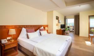 Ein Bett oder Betten in einem Zimmer der Unterkunft Hotel Seppl