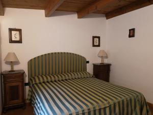 Łóżko lub łóżka w pokoju w obiekcie La Tinaia Country House