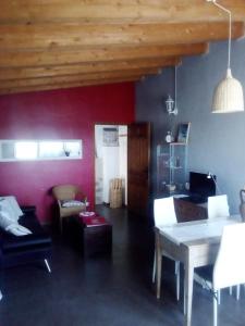 a living room with a table and a couch at Casa De Vacances La Vella Era in Arnés