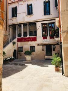 a building with a sign that reads car angel at Ca' Amadi in Venice