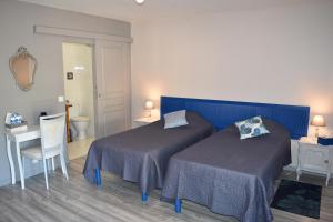 Кровать или кровати в номере Au jardin d'Amphora
