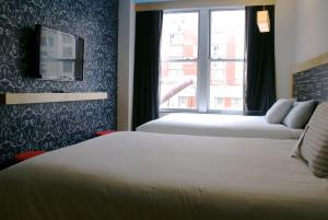 Letto o letti in una camera di TRYP by Wyndham New York City Times Square - Midtown