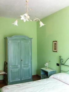 Un pat sau paturi într-o cameră la Piane Del Bagno