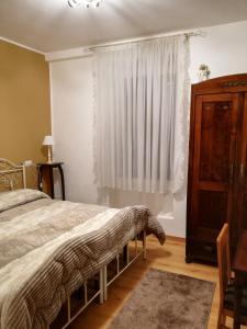 Кровать или кровати в номере Appartamento Collini
