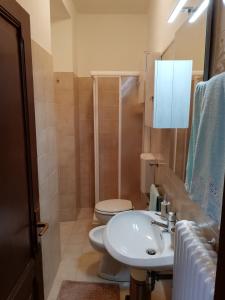 Koupelna v ubytování Appartamento Collini + 7 fotografií
