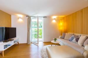 TV a/nebo společenská místnost v ubytování Ferienhaus Bachschlössle