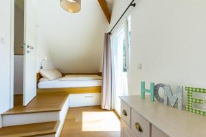Postel nebo postele na pokoji v ubytování Ferienhaus Bachschlössle