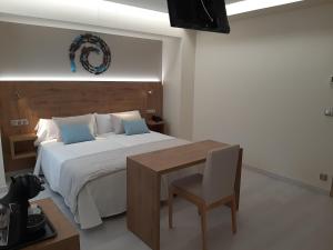 Posteľ alebo postele v izbe v ubytovaní Hotel Boutique O Náutico Laxe