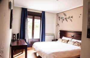 Postel nebo postele na pokoji v ubytování Hotel Rural Camero Viejo