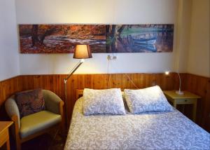 Ένα ή περισσότερα κρεβάτια σε δωμάτιο στο Ξενοδοχείο Χρίστη Παλάς