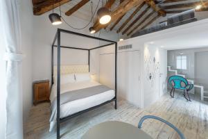 Кровать или кровати в номере Maison Alliod