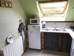 Kuchyň nebo kuchyňský kout v ubytování Gîte du ROCHER + 12 fotografií