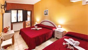 Ένα ή περισσότερα κρεβάτια σε δωμάτιο στο B&b Villa Santa Sofia by holidayngo