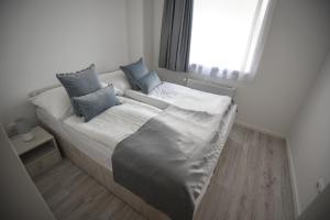 Postel nebo postele na pokoji v ubytování Francesca Apartman