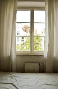 Posteľ alebo postele v izbe v ubytovaní Apartament w Sercu Starówki