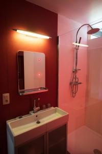 a bathroom with a sink and a mirror at La Lisière in Durbuy