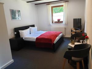 Un pat sau paturi într-o cameră la Sternhaus-Harz