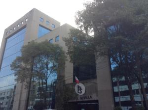 a building with a sign in front of it at Hotel Sevilla in Mexico City