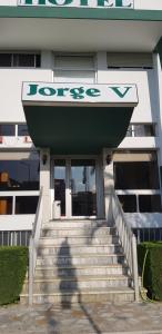 a building with a sign on the front of it at Hotel Jorge V in Mirandela