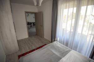 Postel nebo postele na pokoji v ubytování Francesca Apartman