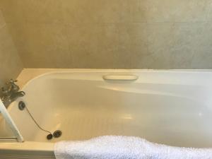 a white bath tub with a faucet in a bathroom at Cill Ard Bohermore in Galway