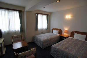 Postel nebo postele na pokoji v ubytování Hotel Sentpia