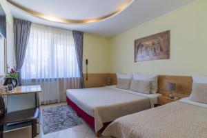 Posteľ alebo postele v izbe v ubytovaní Villa Aida pokoje gościnne