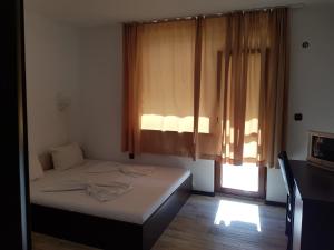 Postel nebo postele na pokoji v ubytování Vladimirov Guest House