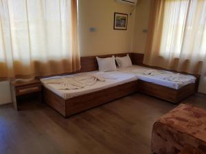 Postel nebo postele na pokoji v ubytování Vladimirov Guest House