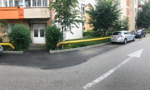 a large yellow pipe on the side of a street at Vama Apartment in Sinaia
