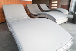 a group of three mattresses sitting in a room at Luxury Villa in Moravany nad Váhom