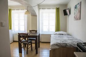 A bed or beds in a room at Penzion-apartmán Souček