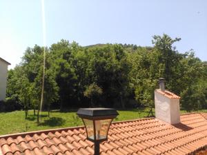 a light on top of a red tile roof at APARTAMENTOS LA CASONA DE EZCARAY CON TERRAZAS y PATIOS INDIVIDUALES in Ezcaray