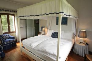 Uma cama ou camas num quarto em Villa Roncavezzai