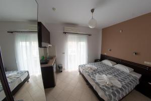 Postel nebo postele na pokoji v ubytování Klepsidra rooms