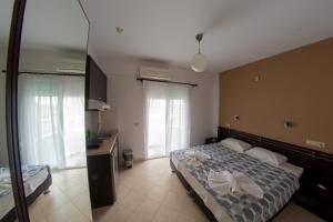 Postel nebo postele na pokoji v ubytování Klepsidra rooms