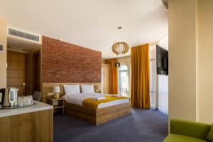Postel nebo postele na pokoji v ubytování Hotel London