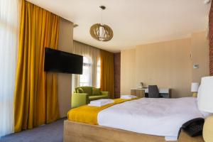 Postel nebo postele na pokoji v ubytování Hotel London