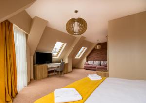 Postel nebo postele na pokoji v ubytování Hotel London