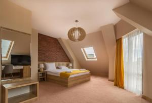 Postel nebo postele na pokoji v ubytování Hotel London