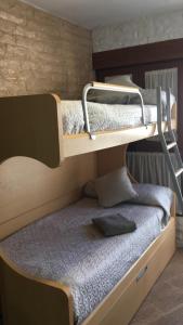 A bunk bed or bunk beds in a room at El Cuchitril