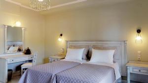 Postel nebo postele na pokoji v ubytování Parga Inn Suites
