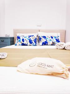 a close up of a bed with a obo mat on it at Gerani Studios in Astypalaia Town