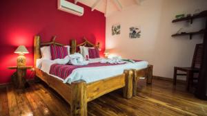 Postel nebo postele na pokoji v ubytování Hotel El Pequeño Gecko Verde