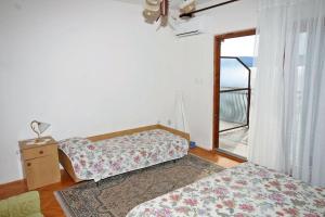 Postel nebo postele na pokoji v ubytování Apartmani Ujdur