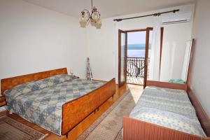 Postel nebo postele na pokoji v ubytování Apartmani Ujdur