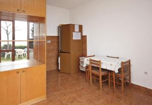 Kuchyň nebo kuchyňský kout v ubytování Apartmani Ujdur