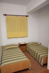 Postel nebo postele na pokoji v ubytování Apartmani Ujdur
