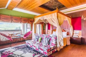 Postel nebo postele na pokoji v ubytování Kenting Maya-House B&B