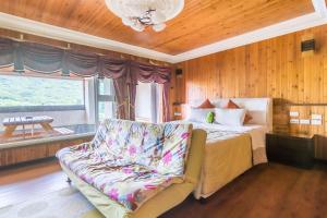 Postel nebo postele na pokoji v ubytování Kenting Maya-House B&B